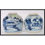 Two late 18th Century Japanese blue and white ginger jars of bulbous form having hand painted