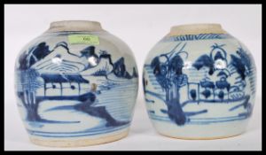 Two late 18th Century Japanese blue and white ginger jars of bulbous form having hand painted