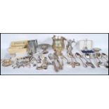 A collection of silver plate and pewter cutlery and table wear to include a good selection of
