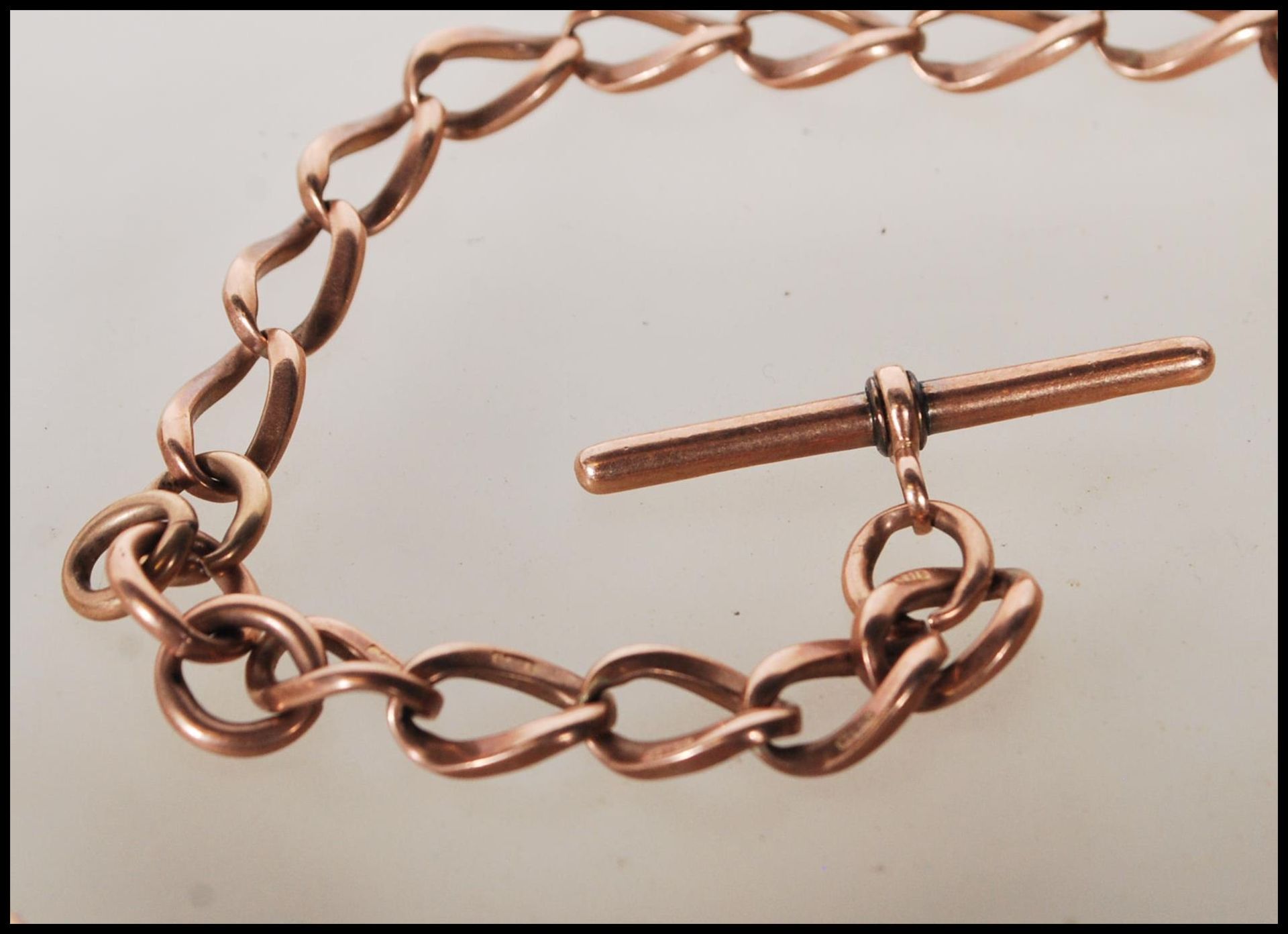 A 9ct gold curb link albert pocket fob watch chain bearing hallmark to every link and T bar, with - Image 2 of 6