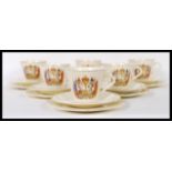 A set of six early 20th Century ceramic tea cup trio's commemorating the Coronation of George VI and