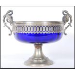 A late 19th Century Victorian silver plated twin handled pedestal bowl having a blue glass liner,