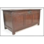 A 17th / 18th Century oak country coffer chest, fielded panel sides and top raised on stile