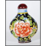 A 20th Century Chinese cloisonne scent bottle, having floral detailing with blue and white geometric