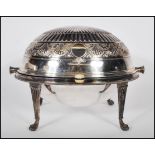 A stunning large Edwardian silver serving tureen with integrated roll over lid of egg form with
