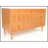 A retro 20th Century teak wood Danish inspired sideboard / credenza, having a configuration of three