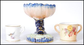 A Royal Worcester table salt, the salt in the form of a Carp / Maltese Dolphin raised on