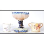 A Royal Worcester table salt, the salt in the form of a Carp / Maltese Dolphin raised on