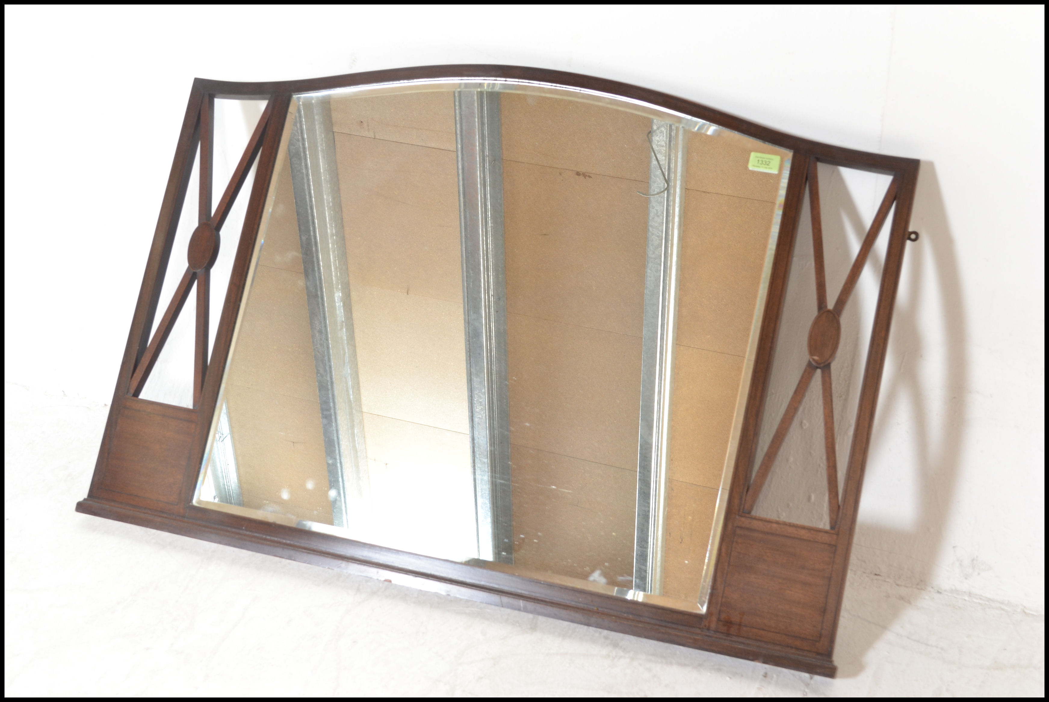 An early 20th Century Edwardian mahogany inlaid arched overmantel wall mirror, central bevelled