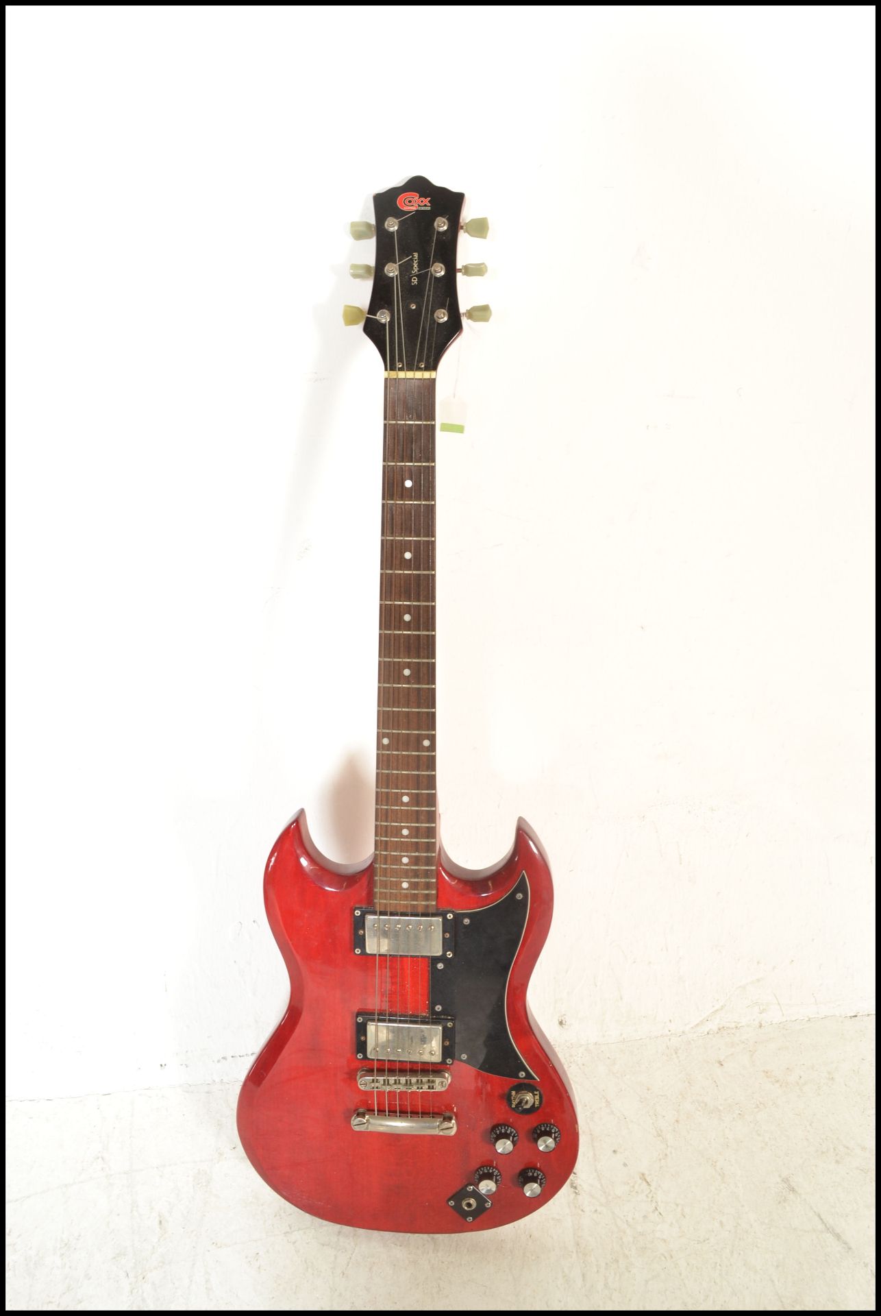 A Gibson SG style six string electric guitar by Co