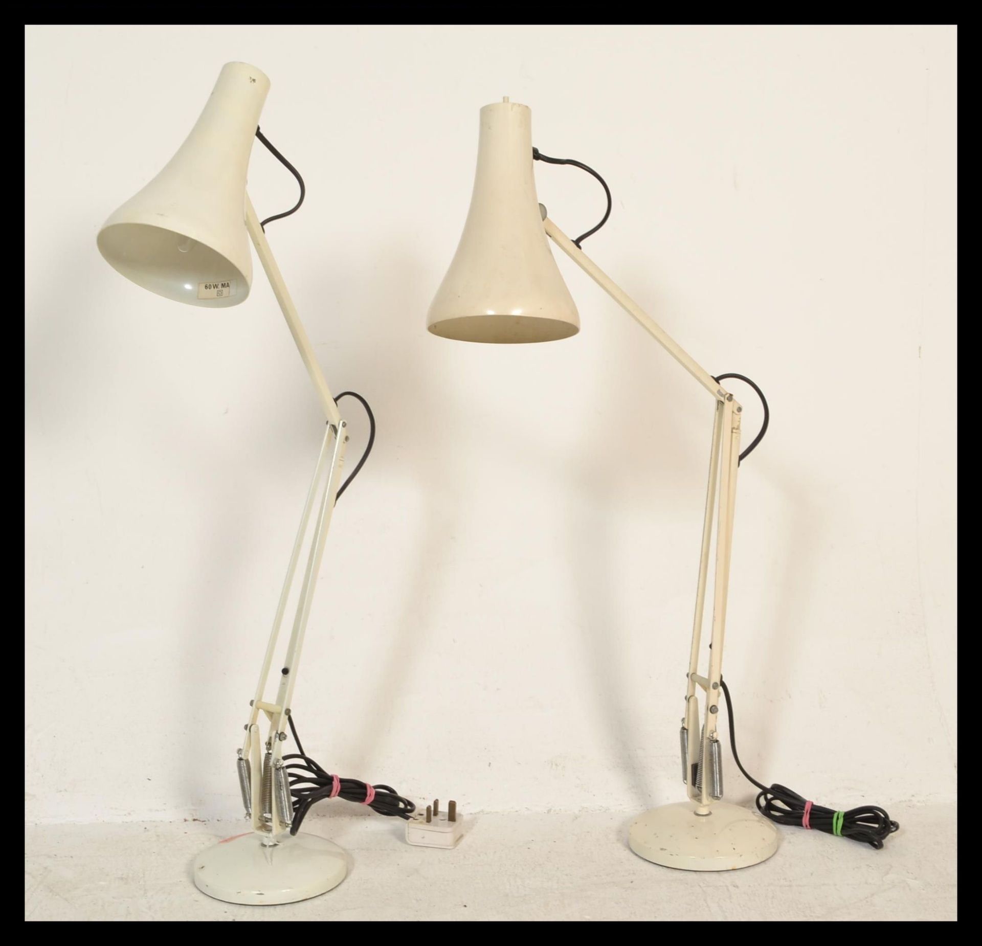 Two vintage retro Herbert Terry 20th Century anglepoise table desk lamps raised on circular bases