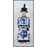A Chinese blue and white glazed ceramic figurine o
