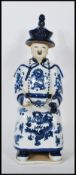 A Chinese blue and white glazed ceramic figurine o