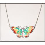 A silver plique a jour opalite Art Nouveau necklace pendant in the form of a butterfly complete with