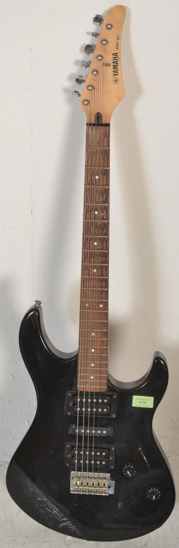 A Yamaha ERG 121 six string electric guitar, finished in black measuring  99cm long