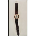A hallmarked 9ct gold 15 jewel Accurist gents wrist watch set to a leather watch bracelet. The watch