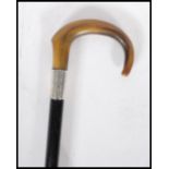 A early 20th Century 1920's silver collared promenade walking stick cane having horn crook handle