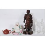 A group of 20th Century Chinese and Japanese ceramic figures to include a pair of blanc de chine