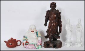 A group of 20th Century Chinese and Japanese ceramic figures to include a pair of blanc de chine