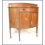 An Edwardian mahogany and satin wood inlaid  demi lune sideboard cabinet. Geometric fashion line