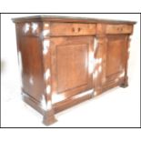 A 19th century French fruitwood and marble brutalist upcycled Buffet De Corps / sideboard. Raised on