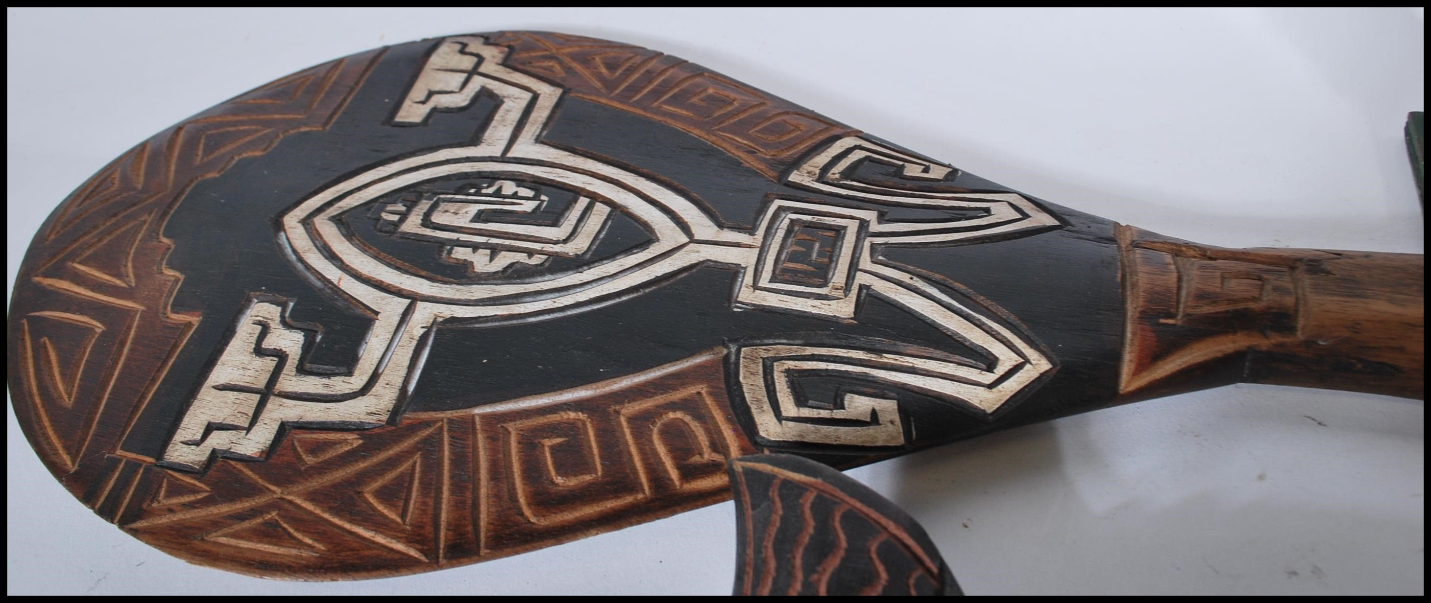 A collection of 20th Century possibly Polynesian ceremonial tribal items to include two non matching - Image 5 of 7