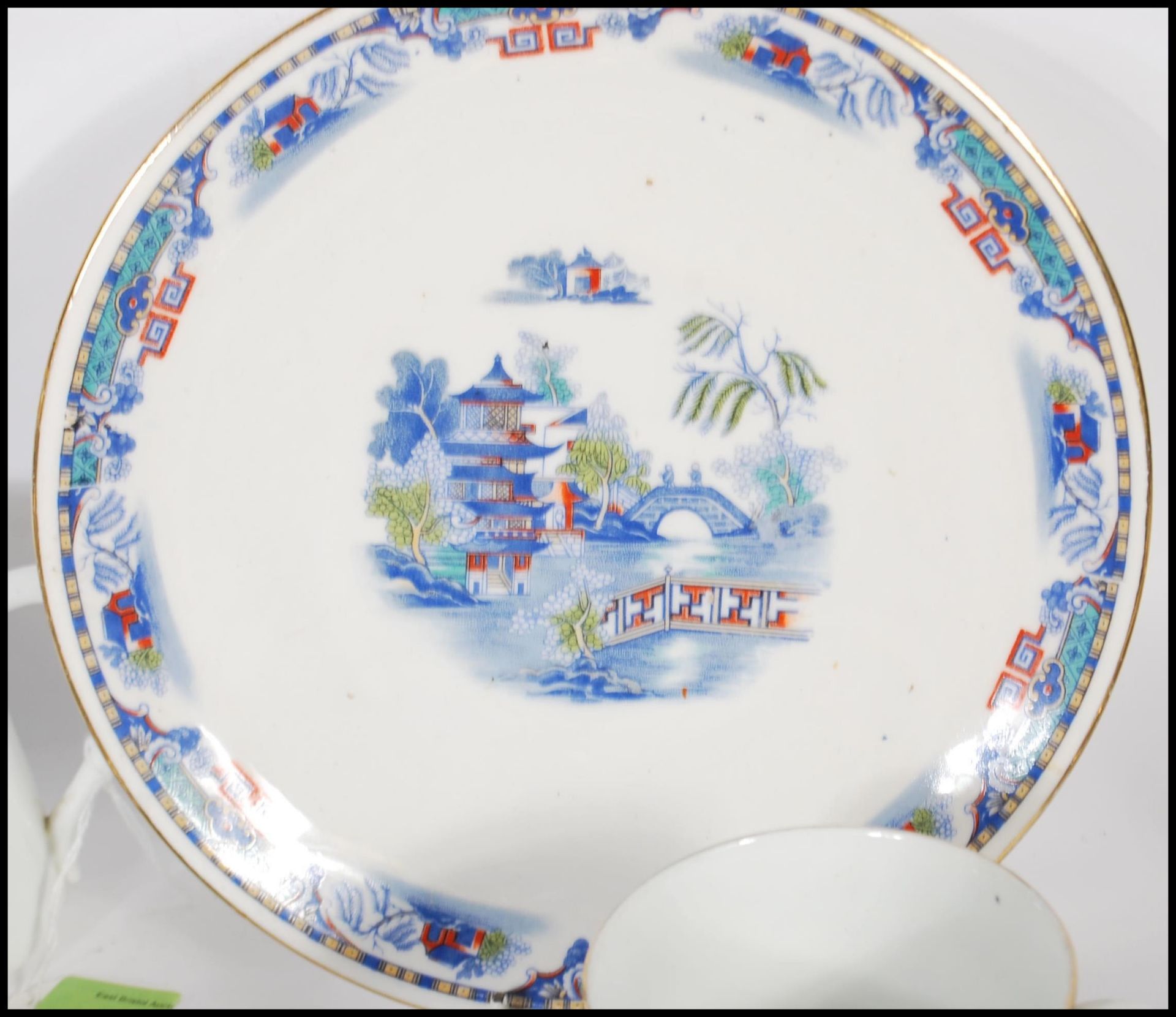 A 20th Century Staffordshire blue and white tea service in the Willow pattern, having red and - Image 6 of 8
