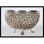 An unusual Siam silver 3 legged sugar bowl being cast in relief with geometric decoration.Unmarked