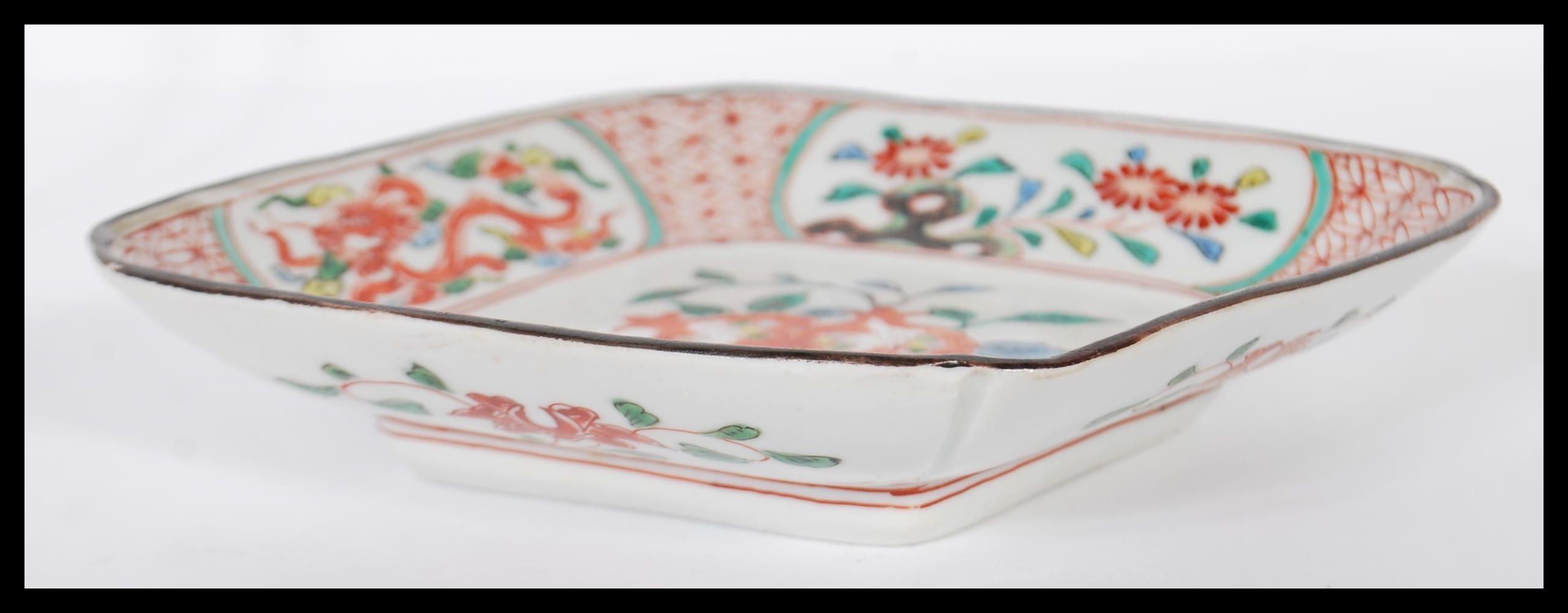 A 19th century Chinese Wucai dish of lozenge form being handpainted with fruit tree cartouche - Image 3 of 4