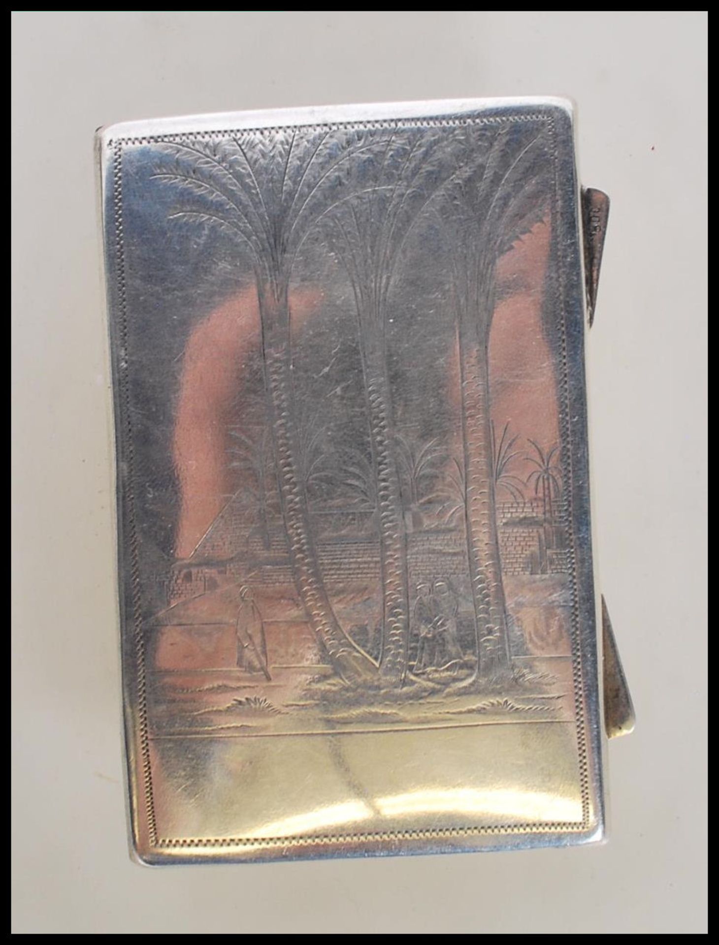 A stamped 800 silver Egyptian wallet / money case having engraved decoration to the front of palm