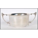 A silver hallmarked twin handled pedestal bowl, scroll handles with acorn finial, Birmingham