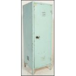 A vintage 20th Century metal locker cabinet finished in light blue, having vents to both top and
