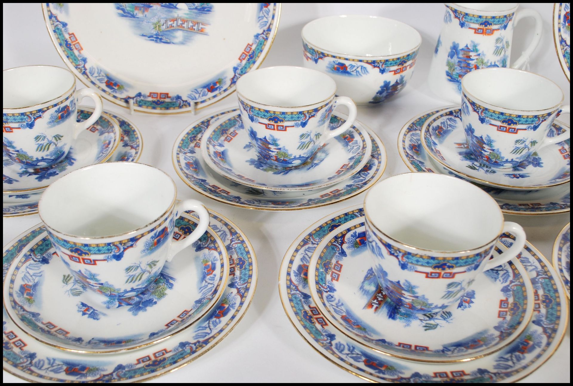 A 20th Century Staffordshire blue and white tea service in the Willow pattern, having red and - Image 4 of 8