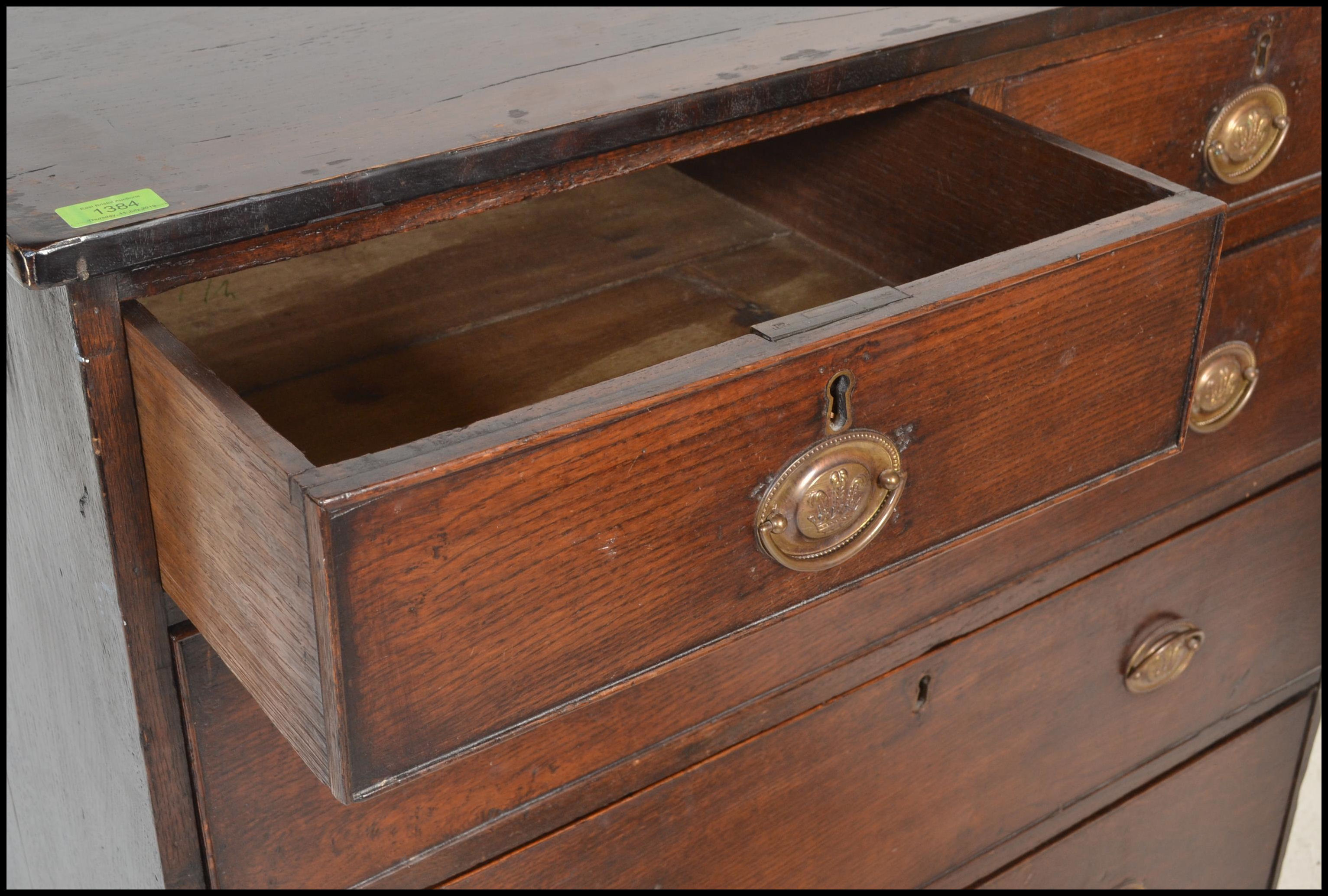 A good 18th / early 19th century oak chest of drawers . Raised on bracket legs the upright chest - Image 4 of 7