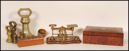 A set of vintage 20th Century postage balance scales along with brass gram weights within a fitted