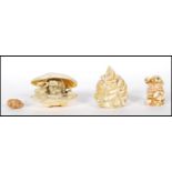 A collection of 20th Century Asian ornaments to include a Harmony Kingdom netsuke style box with a