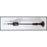 A 19th Century Victorian hand Archimedes drill having a turned wooden handle to the top and spiral