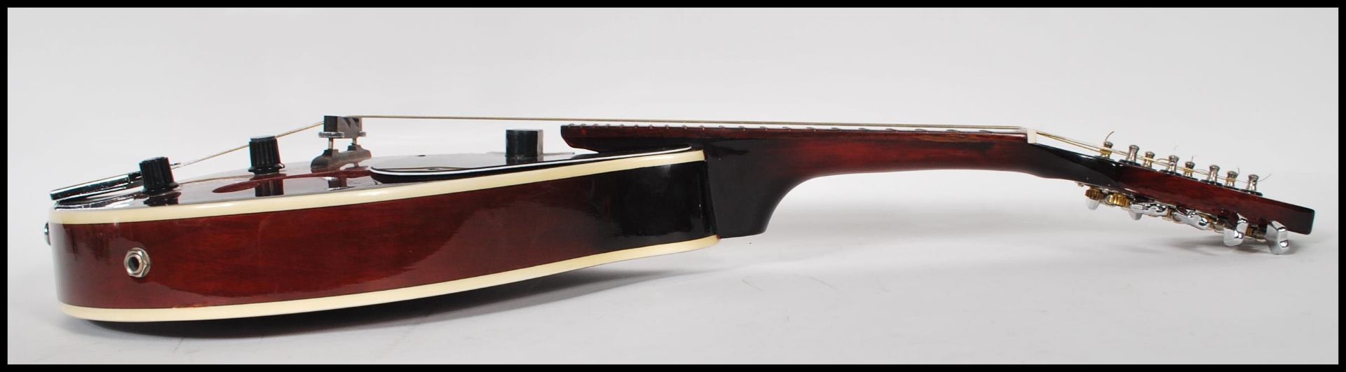 An electric eight string mandolin by Sonata having a shaped dark red body and white borders, with - Bild 8 aus 8