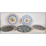 A collection of stoneware Moorish/ Spanish charger plates dating from the early 20th Century, each