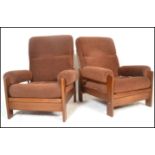 A pair of 20th Century retro vintage easy / lounge / recliner chairs / armchairs having woollen