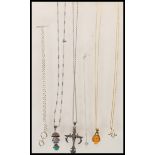 A selection of stamped  925 silver pendant necklaces to include a vermeil necklace set with an amber