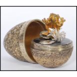 A silver hallmarked Stuart Devlin silver limited edition surprise egg having a stylised floral