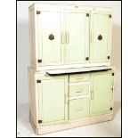 A stunning mid 20th Century kitchen larder cupboard, having a series of cupboards and drawers with