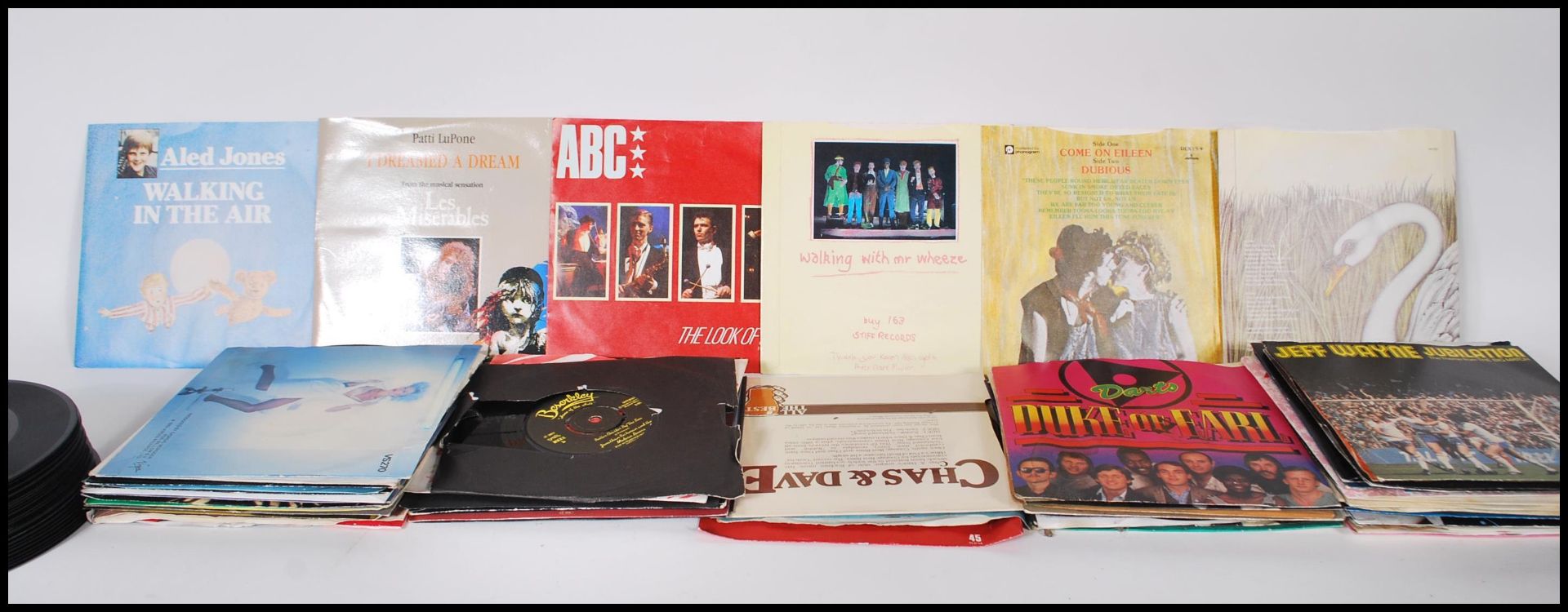 A collection of 7" vinyl 45rpm singles featuring various genres, artists and labels. Some sleeves