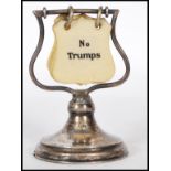 A early 20th Century Vintage silver filled Trump card indicator for the game of Bridge, having