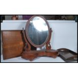 A 19th Century Victorian mahogany swing toilet mirror together with two Edwardian oak twin handled