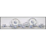 A 20th Century Staffordshire blue and white tea service in the Willow pattern, having red and