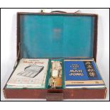 An mid 20th century Oriental Mahjong set, the pieces of bone and bamboo construction held within the