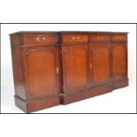 A large Georgian revival mahogany breakfront sideboard / dresser. Raised on a plinth base with a