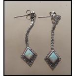 A pair of Art Deco style ladies drop earrings being silver and opalite and in diamond shape form
